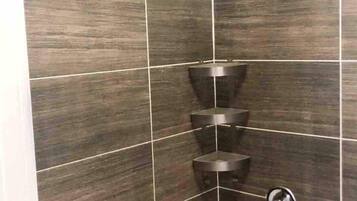 Shower, hair dryer, towels, shampoo