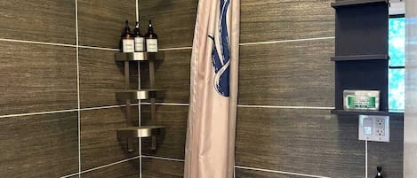 Shower, hair dryer, towels, shampoo