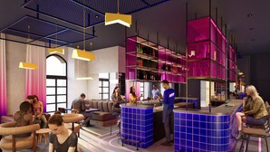 A modern interior with seating areas, a bar, and a counter. - DAFFY Hôtel (Briançon)