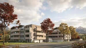 A modern multi-story building with balconies, surrounded by trees and mountains in the background. - Wieshof Wilder Kaiser by ALPS RESORTS (Soell)