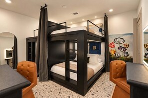 A bunk bed room with a mirror, a desk, and a chair. - Music City Escape w/Rooftop Hot Tub & Pool! 11 Beds (Nashville)