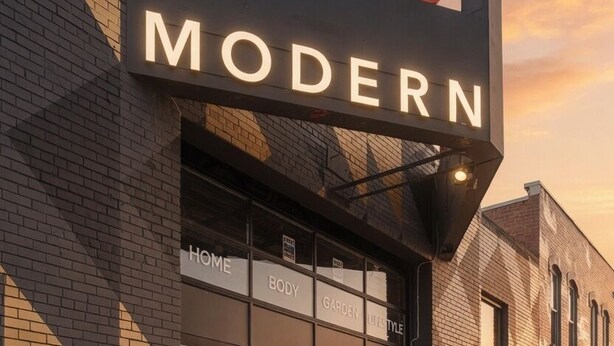 A building with a sign reading 'Emprise MODERN' and sections labeled 'HOME,' 'BODY,' 'GARDEN,' and 'LIFESTYLE.' - Ceros (Denver)