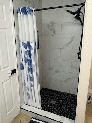 Shower, hair dryer, towels, soap