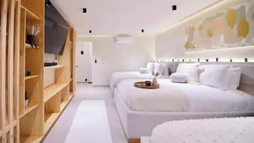 A modern bedroom with two beds, a wooden wardrobe, a flat-screen TV, and a large abstract painting on the wall.