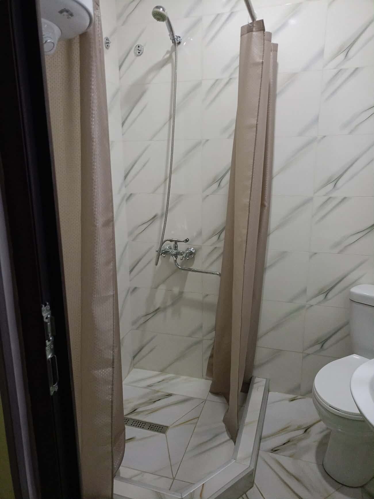 Shower, towels, toilet paper