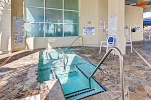 A shallow water pool with no diving allowed, lifeguard duty not on duty, and pool rules posted on the walls. - Oceanfront Two Queen Room + Lazy River & Hot Tub (Myrtle Beach)