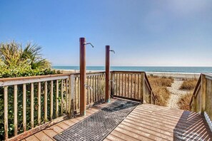 A wooden deck leading to a beach with a clear view of the ocean. - Resort View Two Queen Standard Room + Lazy River & Hot Tub (Myrtle Beach)