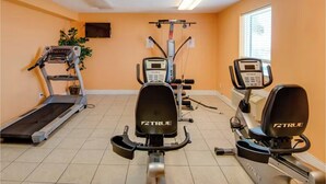 A gym with treadmills, elliptical machines, and weight equipment. - Ocean Ritz 2001! Gulf Views, 4BR Penthouse Beachfront Escape (Panama City Beach)