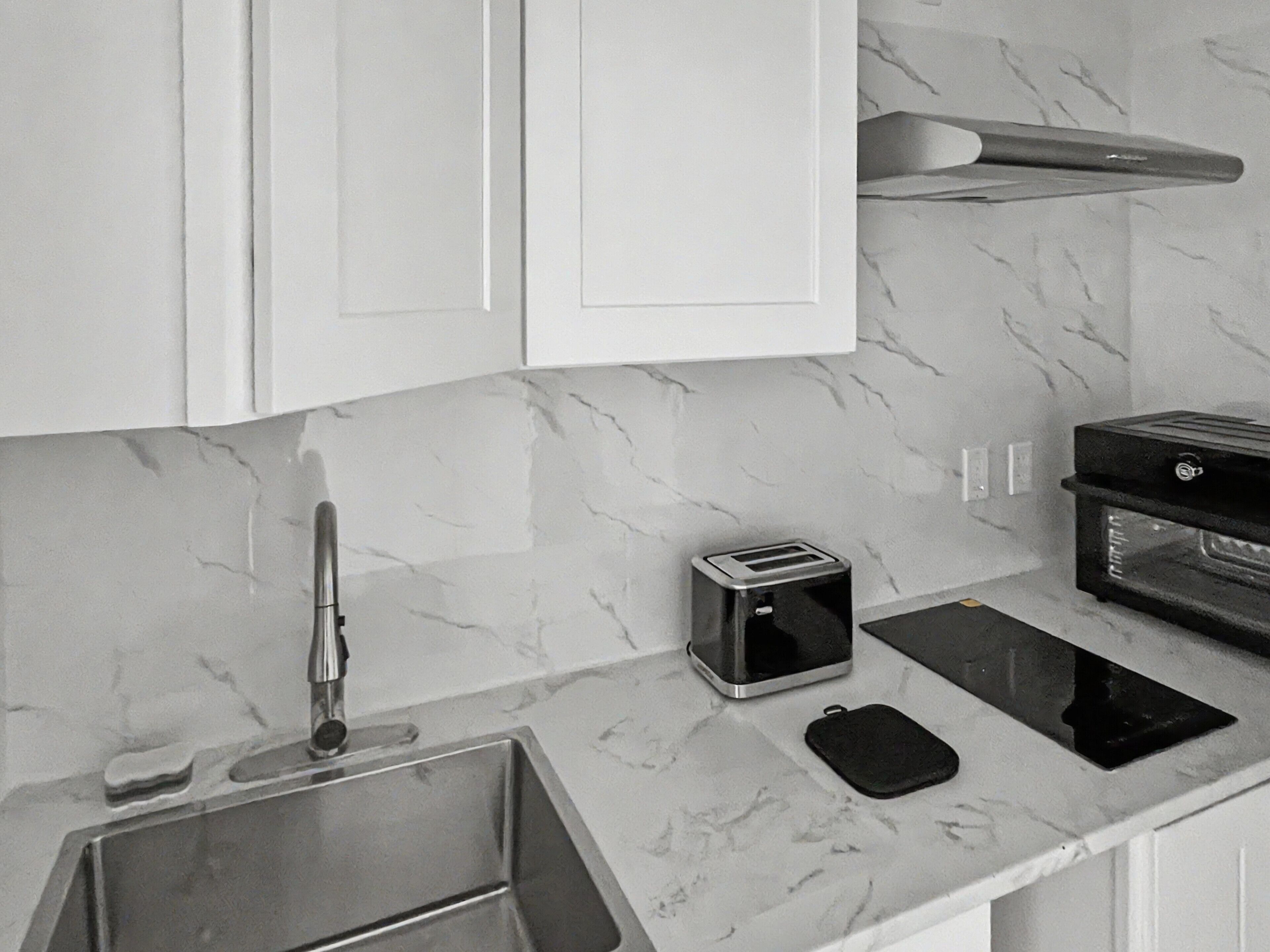 Fridge, stovetop, electric kettle, toaster