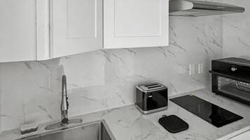 Fridge, stovetop, electric kettle, toaster