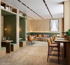 A modern interior with a long bench seating area, a dining table, and built-in shelving. - Apartamento Confortável – Vila Olímpia (São Paulo)