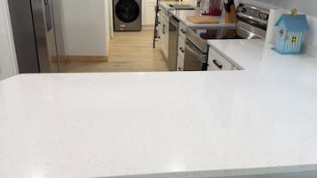 Coffee/tea maker, fridge, microwave, oven