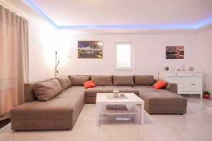 A modern living room with a sectional sofa, a coffee table, and a white cabinet. - Villa Vera-swimming pool, 12 PAX (Donji Kašić)