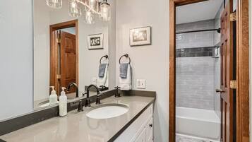 Shower, hair dryer, towels, shampoo
