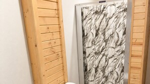 A bathroom with a toilet, sink, and shower. - Spacious Cottage 4 with Loft, Full Kitchen & Stunning Views (Lake Andes)