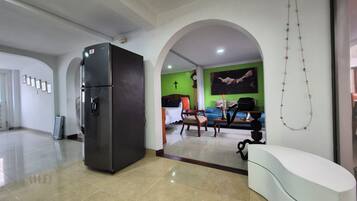 A spacious living area with a modern kitchen, a dining area, and a seating space.
