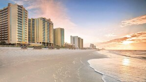 A beachfront hotel with multiple high-rise buildings, a sandy beach, and ocean views. - Family Beach Vacation with Pools & Spacious 2BR Coastal Resort Stay (North Myrtle Beach)