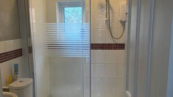Shower, towels, soap, toilet paper