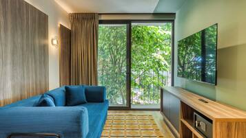 Deluxe Apartment, 1 King Bed with Sofa bed, City View | Living area | 55-inch Smart TV with digital channels