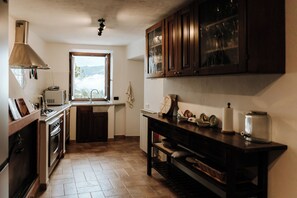 A kitchen with a window, cabinets, and a countertop. - Ready to experience Italy in close proximity, sea, lakes and rivers? (Casciana)