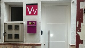A building entrance with a white door, a mailbox marked '17A', and a window with an air conditioning unit. - Front line beach penthouse with large terrace facing the sea! (Puerto de la Cruz)