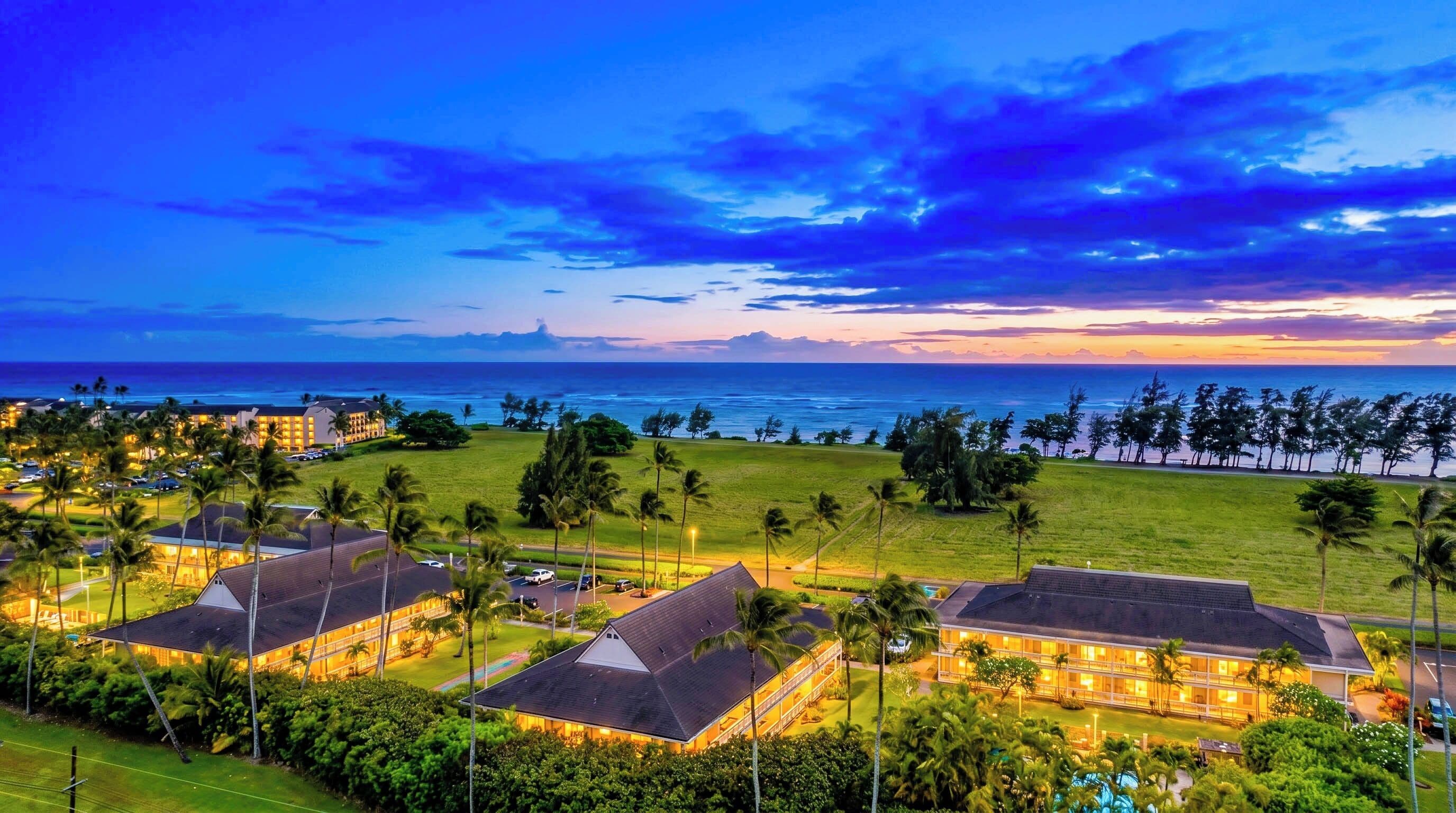 Evenings here are magic — golden lights, ocean air, and sunset skies create the perfect end to a Kauai day.