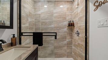 Shower, hair dryer, towels, toilet paper