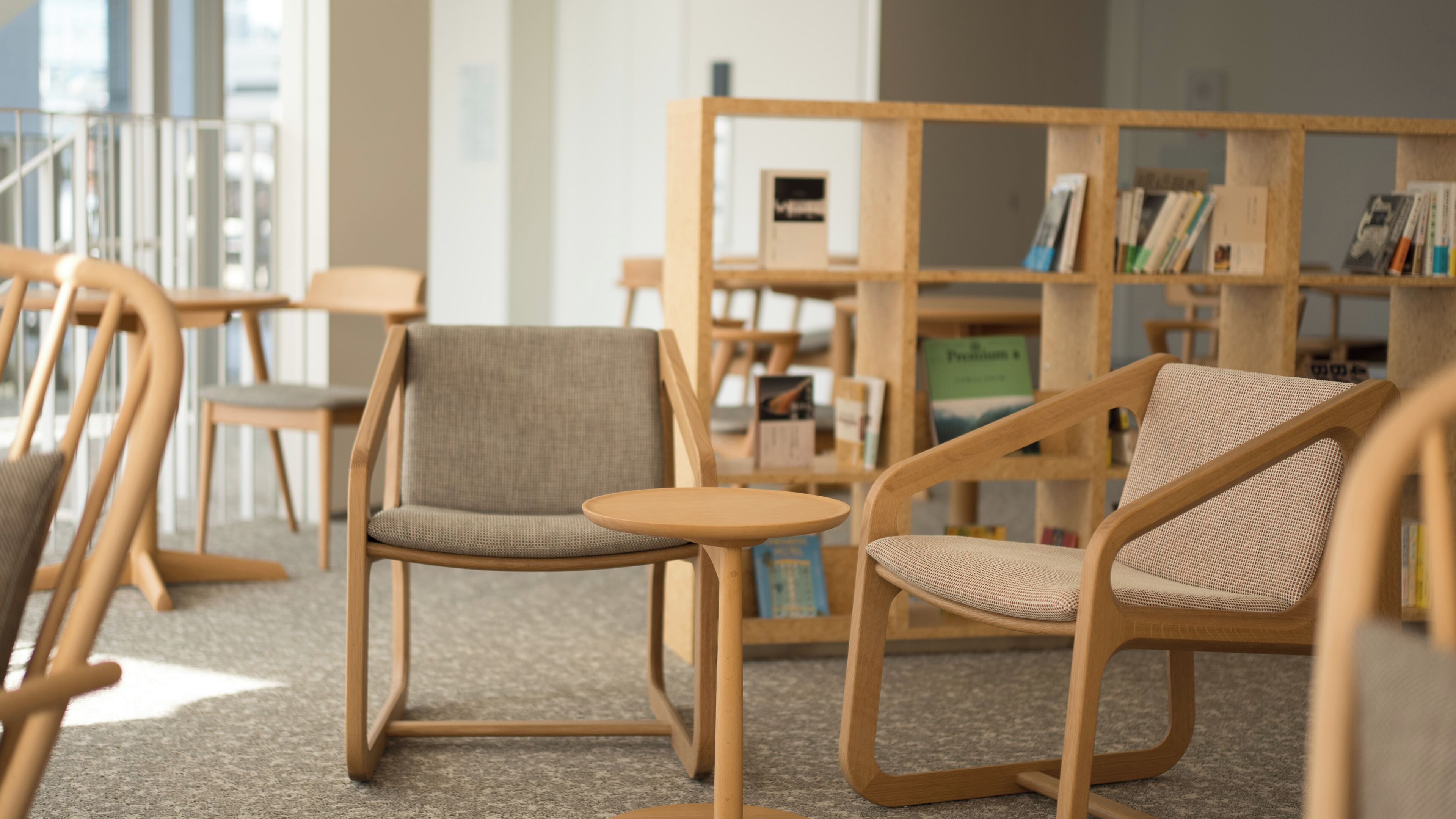 A library with wooden furniture and bookshelves.