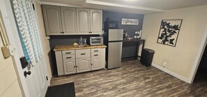 A compact kitchen with a microwave, toaster, and refrigerator. - Ideal Location! Peaceful and Comfy 1 bed/1 bath (Clarksville)