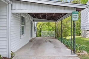 A covered porch with a 'RESERVED Unit B Parking Only' sign. - Ideal Location! Peaceful and Comfy 1 bed/1 bath (Clarksville)