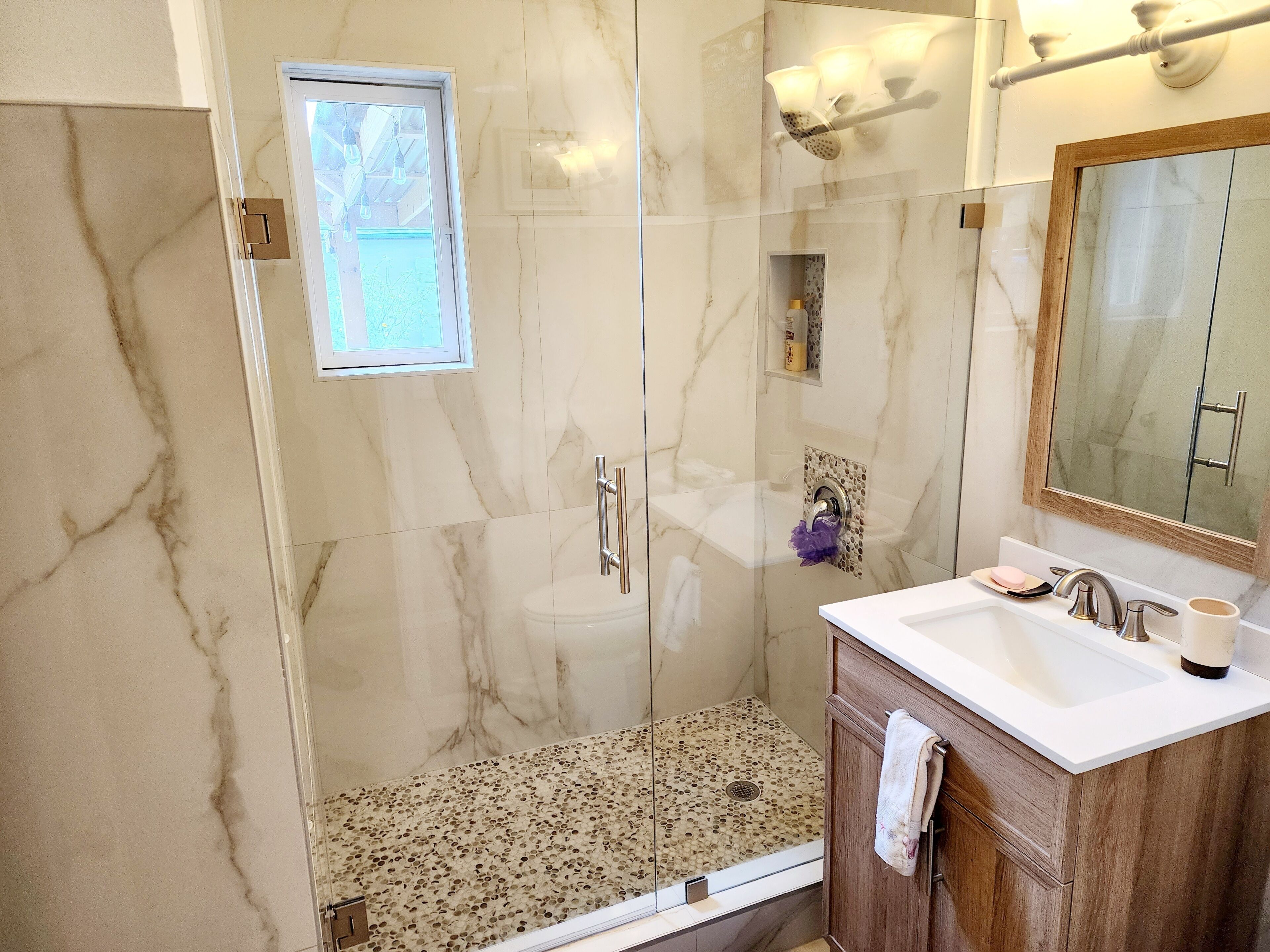 Shower, hair dryer, towels, soap