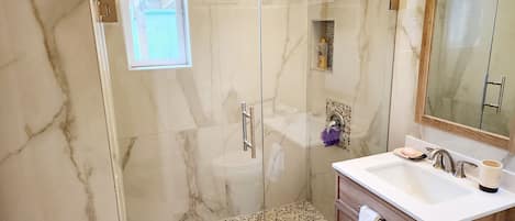 Shower, hair dryer, towels, soap