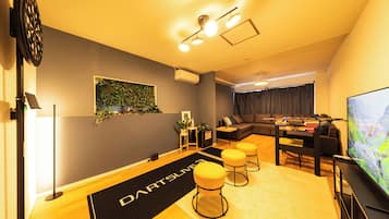 Apartment | Living area | 32-inch flat-screen TV with cable channels