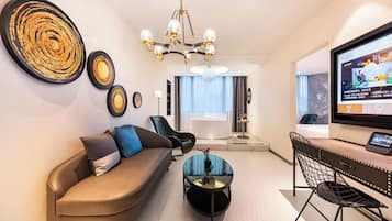 Premier Double Room | Living area | 72-inch LCD TV with cable channels