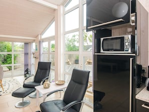A modern kitchen with a microwave and a refrigerator. - 5 Star Holiday Home in Odder (Odder)