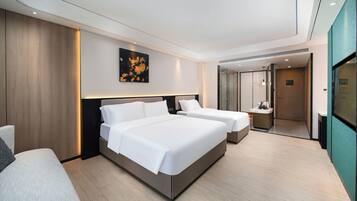 Family Triple Room, City View | Desk, laptop workspace, blackout drapes, soundproofing
