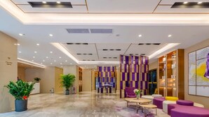 A modern lobby with a marble floor, seating areas, and a reception desk. - Lavande International Hotel Guangzhou Taigucang Shayuan Metro Station Branch - Free Shuttle Bus to Canton Fair Complex During Canton Fair Period (Guangzhou)
