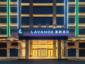 A hotel entrance with a prominent sign reading 'LAVANDE' and Chinese characters. - Lavande International Baiyun Airport (Guangzhou)
