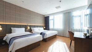 A hotel room with two beds, a desk, and a large window with curtains. - Aifeel Hotel Beijing Capital Airport T3  (Shunyi)