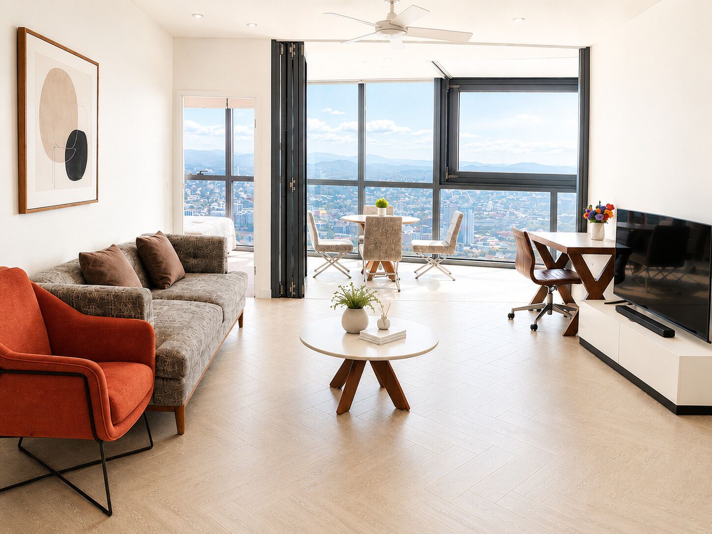 A modern living room with a sofa, a coffee table, a TV, and a city view through large windows.