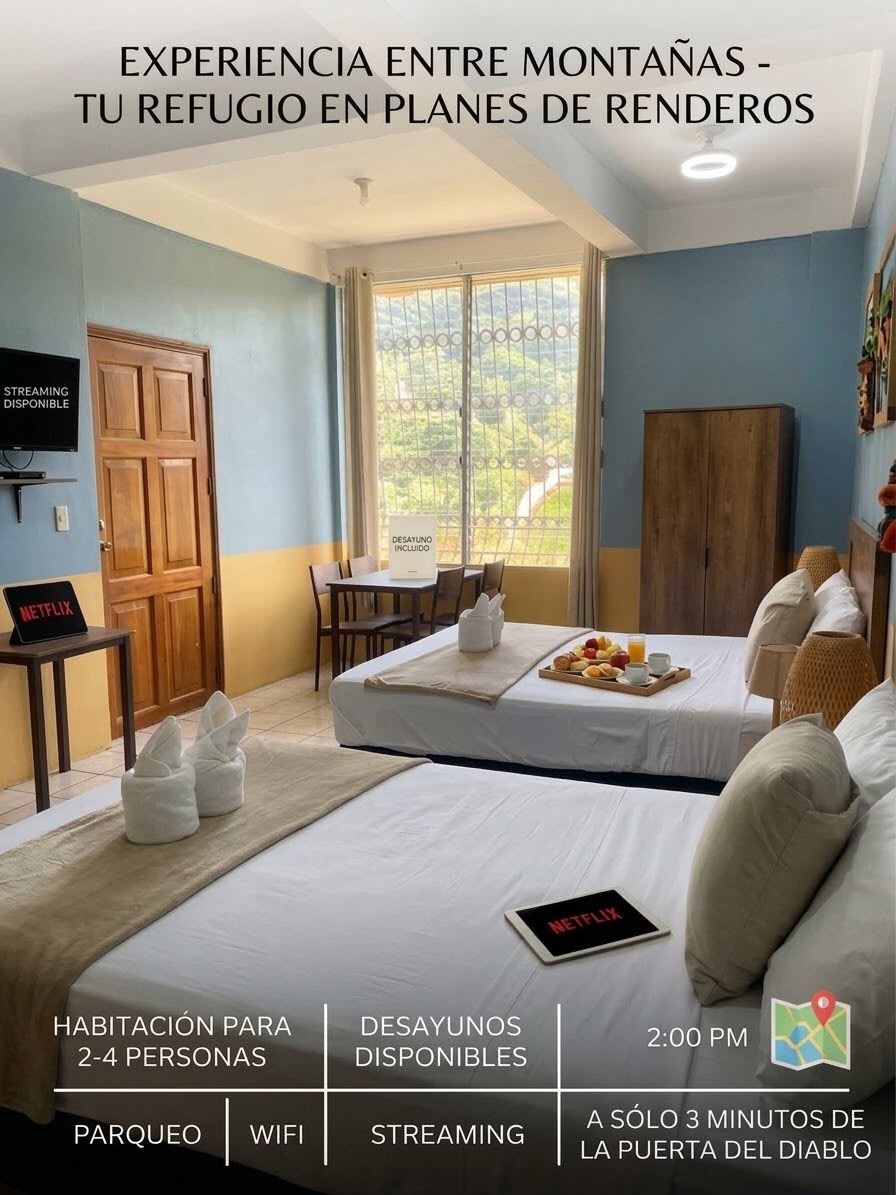 Habitación de hotel con cama, escritorio, silla y bandeja de desayuno. Se observa un cartel que indica 'STREAMING DISPONIBLE' y otro que anuncia 'DESATANCO INCLUIDO'. La habitación tiene vistas al exterior.