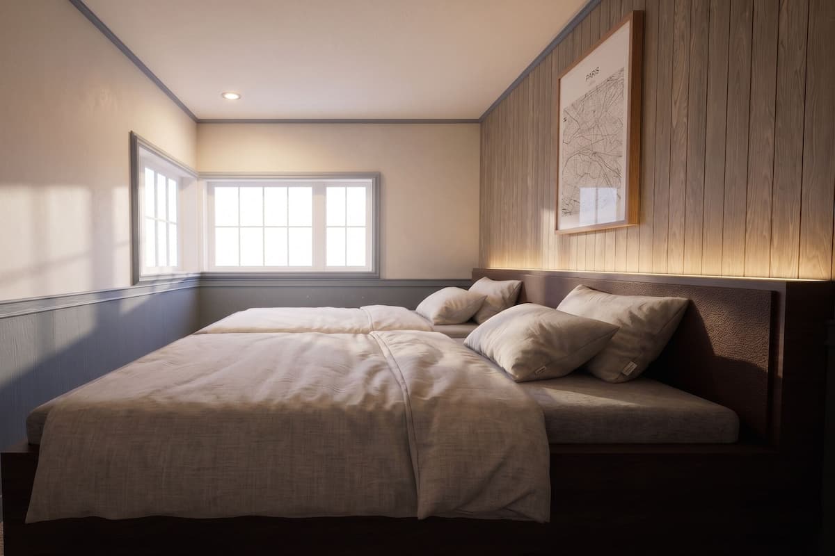 A bedroom with a large bed, a window, and a map on the wall.