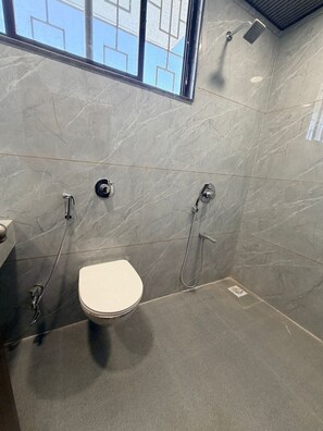 Suite | Bathroom | Rainfall showerhead, free toiletries, hair dryer, slippers - Carnival Inn (Sangamner)