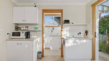 Microwave, electric kettle, toaster, dining tables
