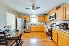 A kitchen with wooden cabinets, a stainless steel refrigerator, a microwave, an oven, and a dishwasher. - 5 Houses to Elizabeth Lake! Family Getaway w/ Yard (Twin Lakes)