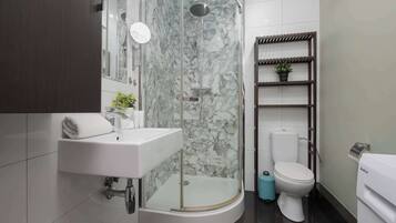 Shower, hair dryer, towels, shampoo