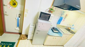A compact kitchen with a microwave, refrigerator, and sink. - Osaka Dotonbori Riverside Walking distance 5 min / Osaka City Ōsaka (Osaka City)