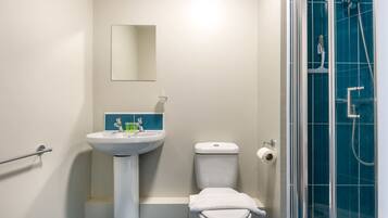 Shower, hair dryer, towels, shampoo