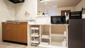 Fridge, microwave, cookware/dishes/utensils