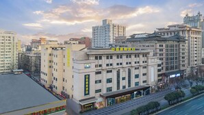 A hotel with a traditional architectural style, multiple floors, and a prominent entrance. - Days Inn Xi'an City Center (Xi'an)